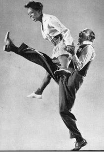 Two dancers dancing the lindy hop